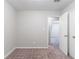 Bedroom featuring neutral walls, plush carpet, and doors for closet and bathroom at 4766 White Oak Path, Stone Mountain, GA 30088