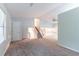 Spacious living room features a staircase, bright lighting, and neutral paint colors at 4766 White Oak Path, Stone Mountain, GA 30088