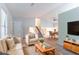 Open-concept living area with a staircase, bright lighting, and a view of the dining area at 4766 White Oak Path, Stone Mountain, GA 30088
