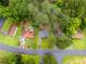 Birds-eye view showcasing property and its location within the neighborhood; mature trees surround houses, offering shade at 6535 Buckhurst Trl, Atlanta, GA 30349