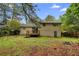 Backyard of a two-story home, featuring a small deck at 6535 Buckhurst Trl, Atlanta, GA 30349
