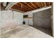 Unfinished basement with concrete walls and a door at 6535 Buckhurst Trl, Atlanta, GA 30349