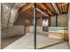 Unfinished basement with exposed ceiling and concrete walls at 6535 Buckhurst Trl, Atlanta, GA 30349