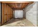 Basement garage featuring a white door at 6535 Buckhurst Trl, Atlanta, GA 30349