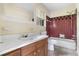 Bathroom with a vintage style tub/shower combo and traditional vanity at 6535 Buckhurst Trl, Atlanta, GA 30349
