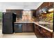 Functional kitchen with updated appliances, a tiled backsplash, and ample cabinet space at 6535 Buckhurst Trl, Atlanta, GA 30349
