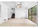 Living room featuring stairs, doors, and sliding glass doors leading to the outside deck at 6535 Buckhurst Trl, Atlanta, GA 30349
