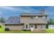 Home featuring an expansive backyard with a patio and two-story siding at 6683 Princeton Park Ct, Lithonia, GA 30058