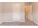 Bedroom with fresh paint and carpet, featuring two doorways and a chair rail at 6683 Princeton Park Ct, Lithonia, GA 30058