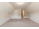 Bonus room featuring gray carpet, fresh paint, and two doorways at 6683 Princeton Park Ct, Lithonia, GA 30058