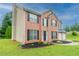 A classic brick facade and a two-car garage complement the well-maintained front yard at 6683 Princeton Park Ct, Lithonia, GA 30058