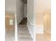 Bright and airy foyer features a staircase and updated flooring, creating a welcoming entrance at 6683 Princeton Park Ct, Lithonia, GA 30058