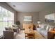 Bright living room boasts a large window and neutral tones, creating an inviting atmosphere at 6683 Princeton Park Ct, Lithonia, GA 30058