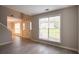 Inviting living room with large window and neutral paint at 6683 Princeton Park Ct, Lithonia, GA 30058