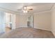Spacious main bedroom with ceiling fan and ensuite bath at 6683 Princeton Park Ct, Lithonia, GA 30058