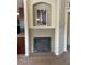 Cozy living room showcasing a tiled fireplace and open access to the kitchen area at 805 Pleasant Hill Nw Rd # 53, Lilburn, GA 30047