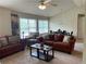 Comfortable living room with sofas, patterned armchairs, and natural light coming through windows at 805 Pleasant Hill Nw Rd # 53, Lilburn, GA 30047