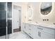 Contemporary bathroom with double vanity, modern fixtures, and stylish marble flooring at 115 Thome Dr, Alpharetta, GA 30022