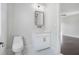 Contemporary powder room featuring a modern vanity and lighting at 115 Thome Dr, Alpharetta, GA 30022