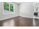Bright bedroom with hardwood floors and a connected bathroom at 115 Thome Dr, Alpharetta, GA 30022
