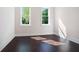 Bright bedroom with hardwood floors and natural light streaming through the windows at 115 Thome Dr, Alpharetta, GA 30022