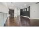 Spacious living room featuring hardwood floors, recessed lighting, and neutral walls at 115 Thome Dr, Alpharetta, GA 30022
