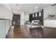 Bright living room with a modern sofa, dark wood floors, and minimalist decor at 115 Thome Dr, Alpharetta, GA 30022