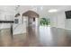 Bright open concept living room with modern kitchen, fireplace and access to the backyard at 115 Thome Dr, Alpharetta, GA 30022