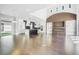 Bright open concept living room with high ceilings, fireplace and modern kitchen at 115 Thome Dr, Alpharetta, GA 30022
