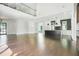 Spacious living room featuring hardwood floors, modern kitchen, and abundant natural light at 115 Thome Dr, Alpharetta, GA 30022
