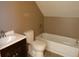 Upstairs bathroom featuring a vanity, toilet, and soaking tub with shower, providing convenience at 3096 Campground Rd, Winston, GA 30187