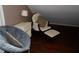 Cozy bedroom nook with a comfortable rocking chair, soft lighting, and hardwood floors at 3096 Campground Rd, Winston, GA 30187