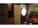 Features of the kitchen area with a stainless steel refrigerator and custom cabinets at 3096 Campground Rd, Winston, GA 30187