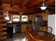 Kitchen with stainless steel appliances, wood cabinets, and an eat-in table at 3096 Campground Rd, Winston, GA 30187