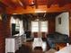 Comfortable living room features wood beams, a fireplace, and plenty of natural light at 3096 Campground Rd, Winston, GA 30187