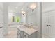 Elegant bathroom with a soaking tub, vanity, and great lighting at 4161 Thunderbird Se Dr, Marietta, GA 30067