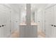 Well-lit bathroom with double vanities, tile floors, and a walk-in shower at 4161 Thunderbird Se Dr, Marietta, GA 30067