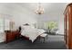 Spacious bedroom with a chandelier, sitting area, and ample natural light at 4161 Thunderbird Se Dr, Marietta, GA 30067