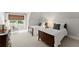 Cozy bedroom with two beds, a large window, and soft neutral tones at 4161 Thunderbird Se Dr, Marietta, GA 30067