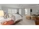 Bedroom showcasing a comfortable bed, natural light, and neutral color palette at 4161 Thunderbird Se Dr, Marietta, GA 30067