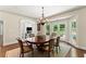Bright dining room with natural light, French doors to the pool, and seating for six at 4161 Thunderbird Se Dr, Marietta, GA 30067