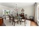 Dining room featuring a glass table and elegant chandelier creating a warm ambiance at 4161 Thunderbird Se Dr, Marietta, GA 30067