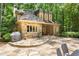 Charming exterior with stone accents, manicured landscaping, and a cozy patio area perfect for outdoor entertaining at 4161 Thunderbird Se Dr, Marietta, GA 30067