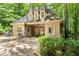 Charming exterior with stone accents, manicured landscaping, and a cozy patio area perfect for outdoor entertaining at 4161 Thunderbird Se Dr, Marietta, GA 30067