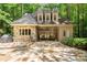 Charming exterior with stone accents, manicured landscaping, and a cozy patio area perfect for outdoor entertaining at 4161 Thunderbird Se Dr, Marietta, GA 30067