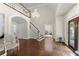 Grand foyer with hardwood floors, staircase, and decorative light fixture at 4161 Thunderbird Se Dr, Marietta, GA 30067