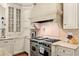 Kitchen featuring stainless steel appliances, stone counters, and custom cabinets at 4161 Thunderbird Se Dr, Marietta, GA 30067