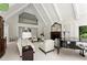 Elegant living area featuring a fireplace and a large window, creating a bright and inviting space at 4161 Thunderbird Se Dr, Marietta, GA 30067