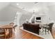 Living room with a hardwood floor, comfortable seating, and a large, wall-mounted TV at 4161 Thunderbird Se Dr, Marietta, GA 30067