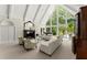 Sophisticated living room featuring a fireplace, high ceilings, and ample natural light at 4161 Thunderbird Se Dr, Marietta, GA 30067